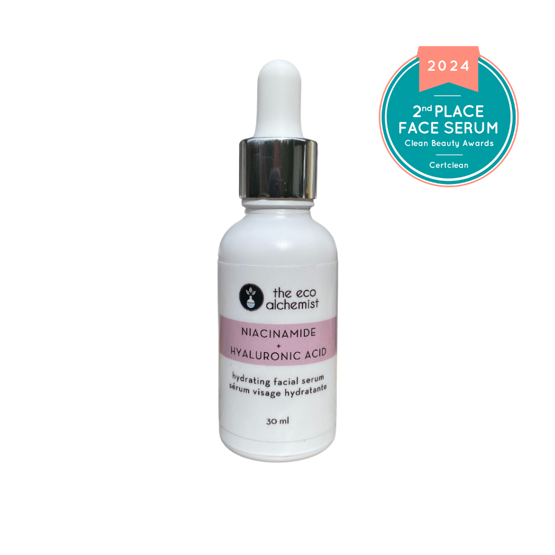 A bottle of Niacinamide + Hyaluronic Acid Hydrating Facial Serum by The Eco Alchemist, with a dropper, on a white background with a '2nd Place Face Serum' award seal indicating it won a Clean Beauty Award in 2024